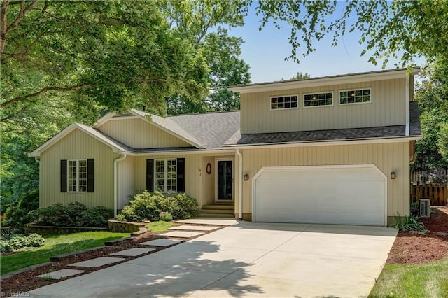 7 Pineburr Ct, Greensboro, NC 27455 - view of front of house with driveway, roof with shingles, and a garage