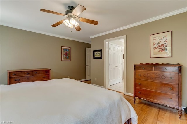 7 Pineburr Ct, Greensboro, NC 27455 - bedroom with ornamental molding, light wood-style flooring, a ceiling fan, ensuite bath, and baseboards