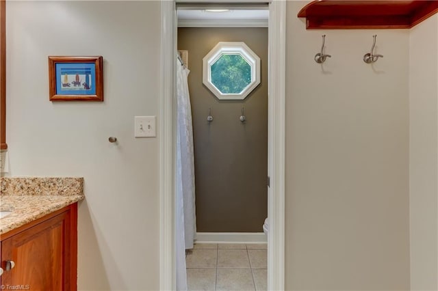 7 Pineburr Ct, Greensboro, NC 27455 - bathroom with toilet, vanity, tile patterned flooring, baseboards, and ornamental molding