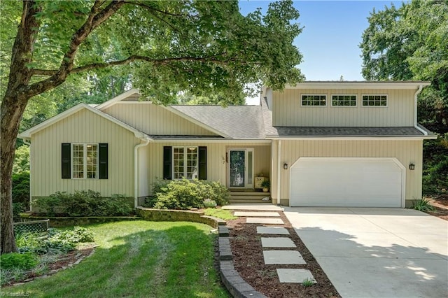 7 Pineburr Ct, Greensboro, NC 27455 - view of front facade featuring driveway, roof with shingles, and a front lawn
