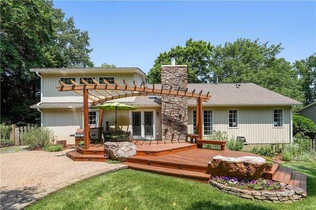 7 Pineburr Ct, Greensboro, NC 27455 - back of property featuring a pergola, a wooden deck, and a chimney