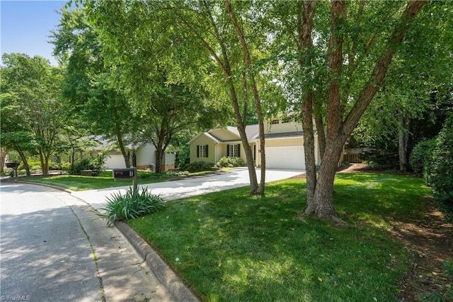 7 Pineburr Ct, Greensboro, NC 27455 - view of front of property with concrete driveway, a front yard, and an attached garage