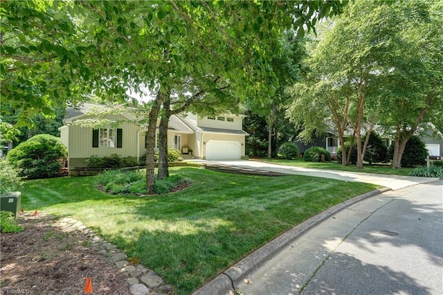 7 Pineburr Ct, Greensboro, NC 27455 - view of property hidden behind natural elements featuring driveway, an attached garage, and a front yard