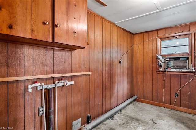 detailed view of wooden walls and unfinished concrete flooring