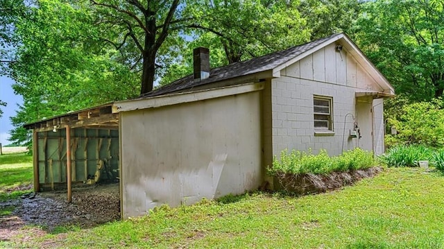 view of outdoor structure featuring an outbuilding and a detached carport