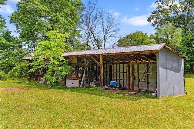 view of pole building with a lawn