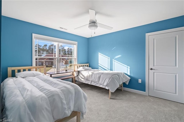 carpeted bedroom featuring ceiling fan