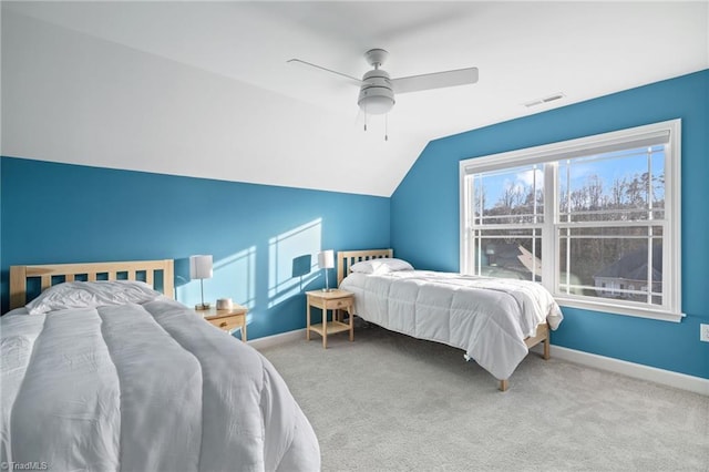 bedroom with lofted ceiling, ceiling fan, and carpet flooring