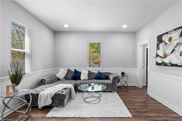 living area with recessed lighting, dark wood-style floors, and wainscoting