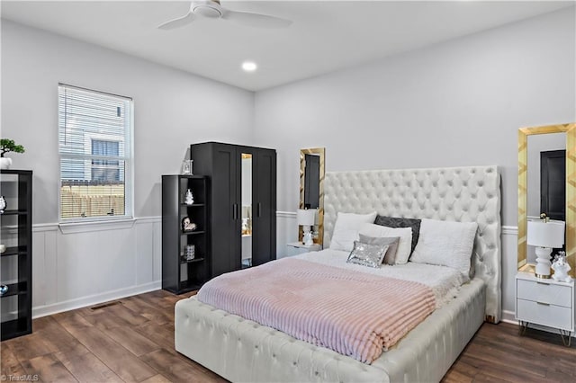 bedroom featuring a wainscoted wall, a ceiling fan, recessed lighting, and wood finished floors