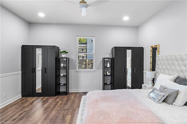 bedroom featuring wainscoting, ceiling fan, recessed lighting, and dark wood-style floors