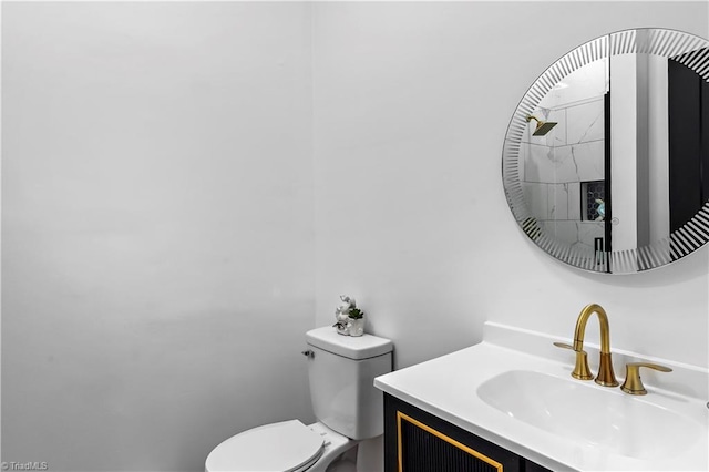 bathroom featuring toilet and vanity
