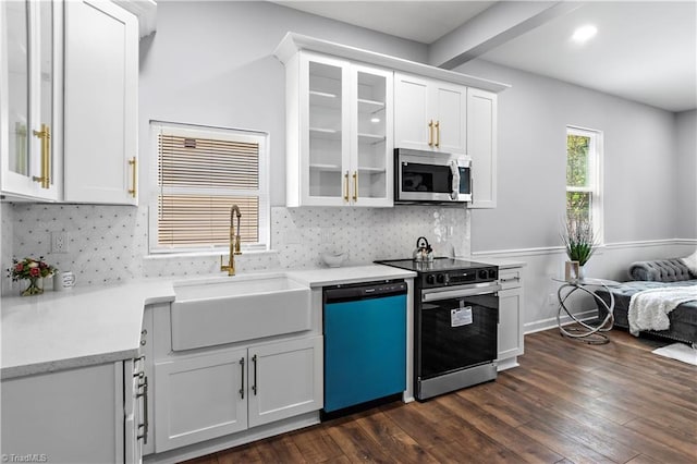 kitchen with white cabinets, a sink, electric stove, stainless steel microwave, and dishwashing machine