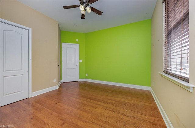 unfurnished bedroom featuring ceiling fan and light wood-type flooring