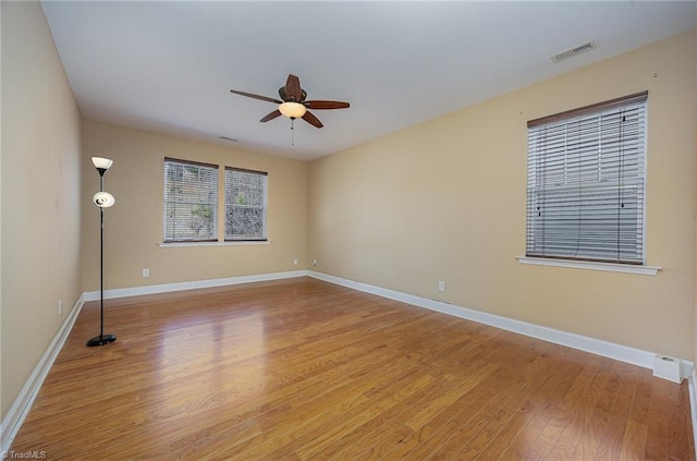 spare room featuring ceiling fan and light hardwood / wood-style flooring