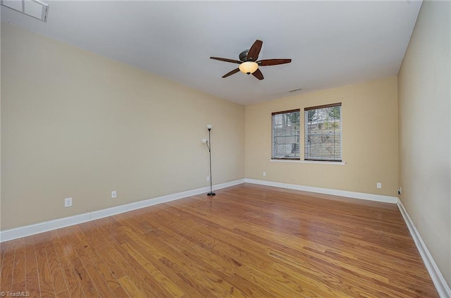 unfurnished room with ceiling fan and light wood-type flooring