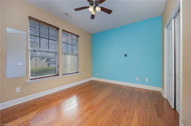 unfurnished bedroom featuring ceiling fan and hardwood / wood-style flooring