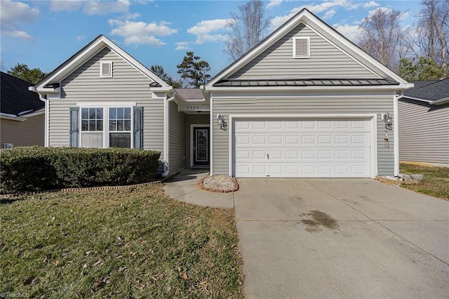 view of front facade with a front lawn and a garage