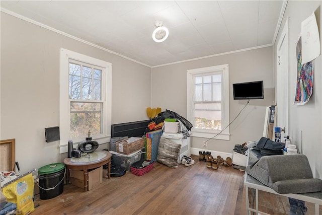 miscellaneous room with ornamental molding and hardwood / wood-style floors