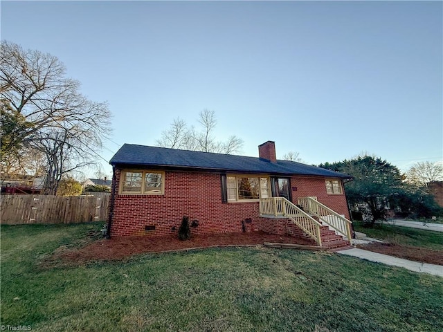 ranch-style home featuring a front yard