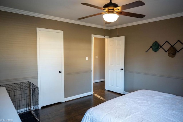 bedroom with dark wood-type flooring, ceiling fan, and ornamental molding