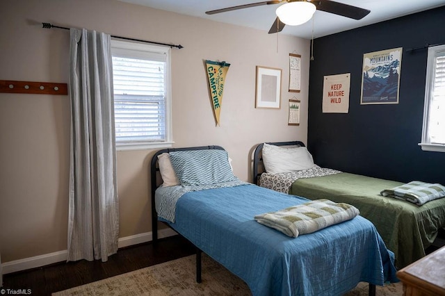 bedroom featuring ceiling fan and dark wood-type flooring