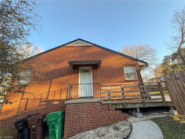 view of property exterior with a deck