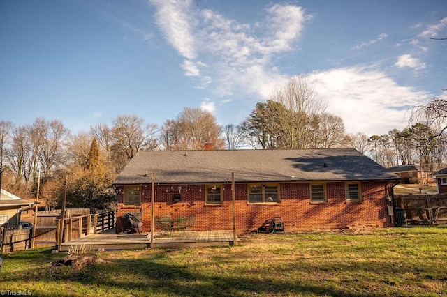 back of property featuring cooling unit, a yard, and a wooden deck