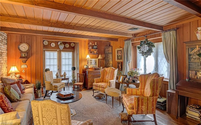 interior space with beamed ceiling, wooden ceiling, and wood walls