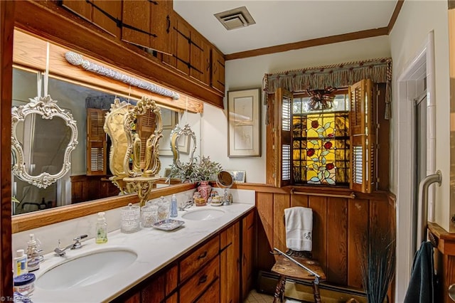 bathroom with crown molding, wooden walls, vanity, and a baseboard radiator