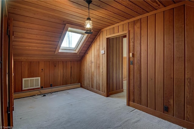 bonus room with vaulted ceiling with skylight, wooden walls, wood ceiling, light carpet, and a baseboard heating unit