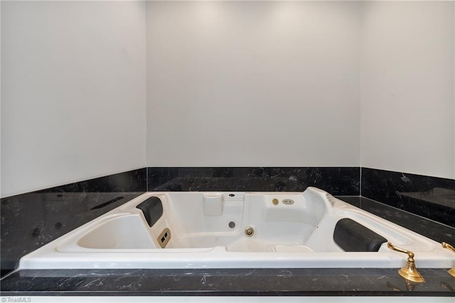 bathroom featuring a relaxing tiled tub