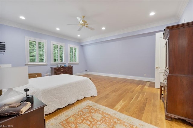 bedroom featuring ceiling fan, light hardwood / wood-style floors, and ornamental molding