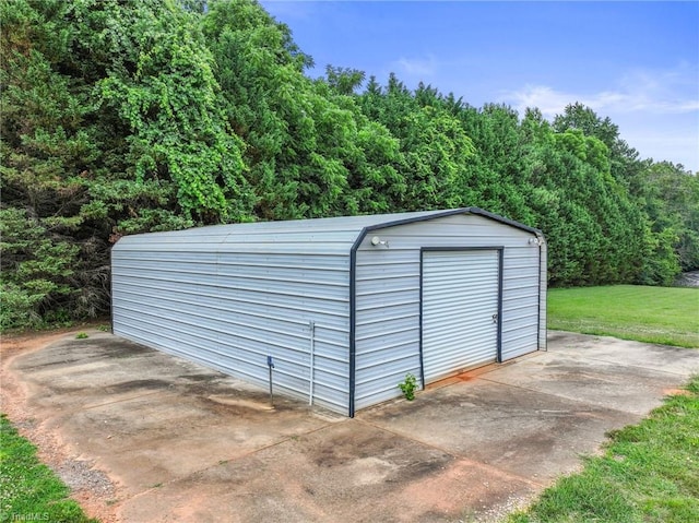 view of outdoor structure with a lawn