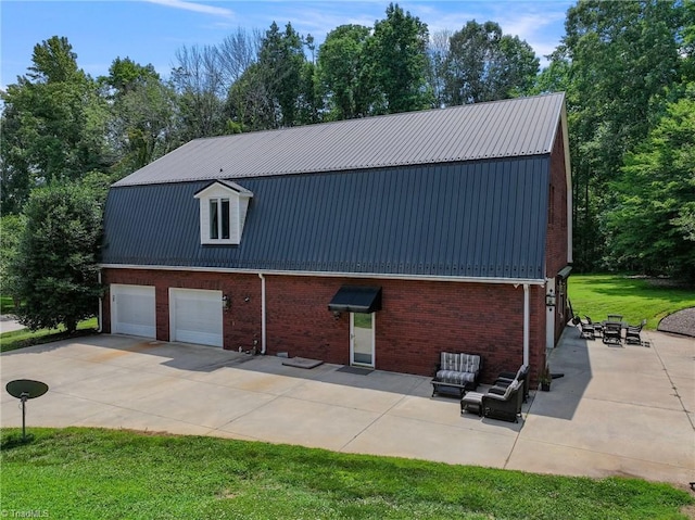 view of property exterior featuring a garage, a yard, and a patio