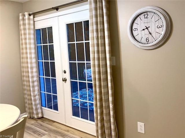 entryway featuring french doors and wood finished floors
