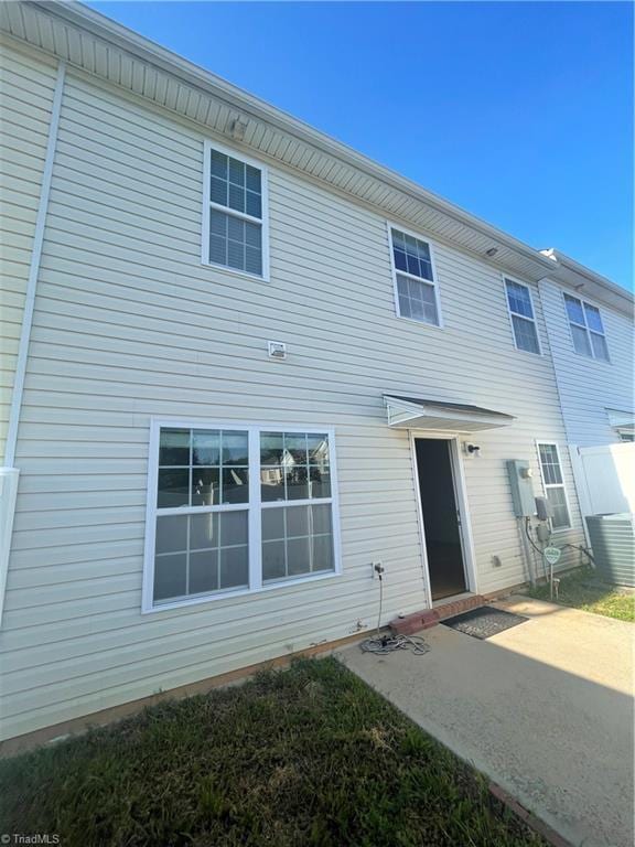 rear view of property featuring a patio