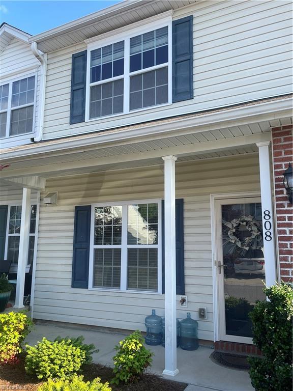 doorway to property featuring covered porch