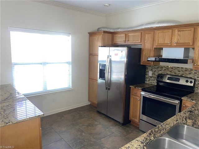 kitchen with baseboards, appliances with stainless steel finishes, ventilation hood, and light stone countertops