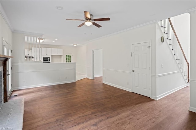 unfurnished living room featuring ceiling fan, ornamental molding, and dark hardwood / wood-style flooring