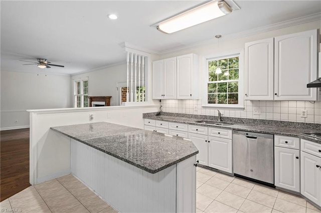 kitchen featuring sink, ceiling fan, stainless steel dishwasher, white cabinets, and crown molding