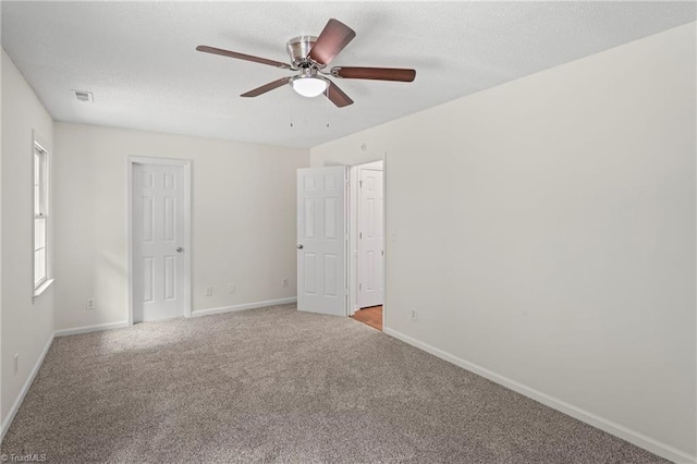 unfurnished room with light carpet and ceiling fan