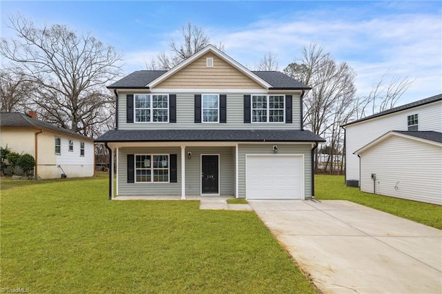 front of property featuring a front lawn and a garage