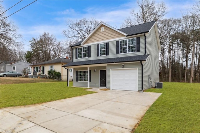 front of property featuring a front yard, a garage, and central air condition unit