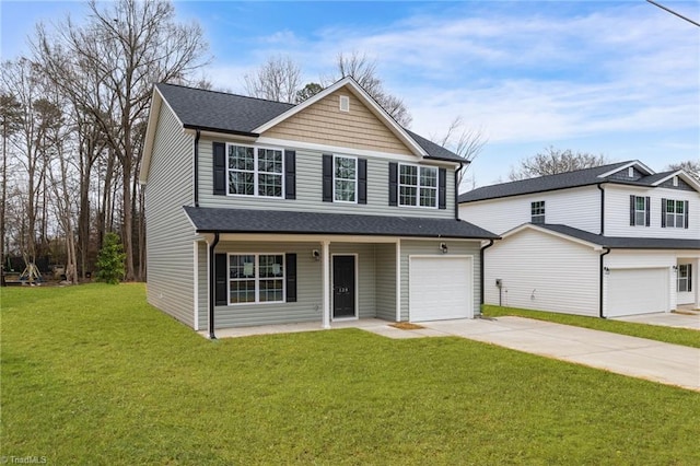 view of front property featuring a porch, a garage, and a front lawn