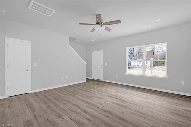 unfurnished living room featuring light wood-type flooring and ceiling fan