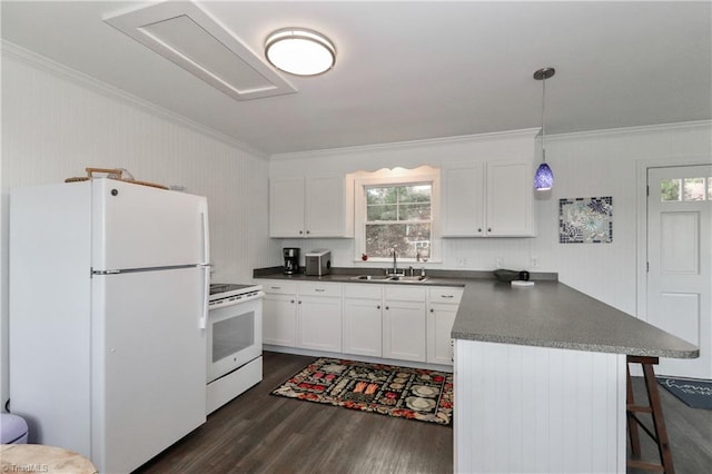 kitchen featuring sink, pendant lighting, white appliances, a kitchen bar, and white cabinets