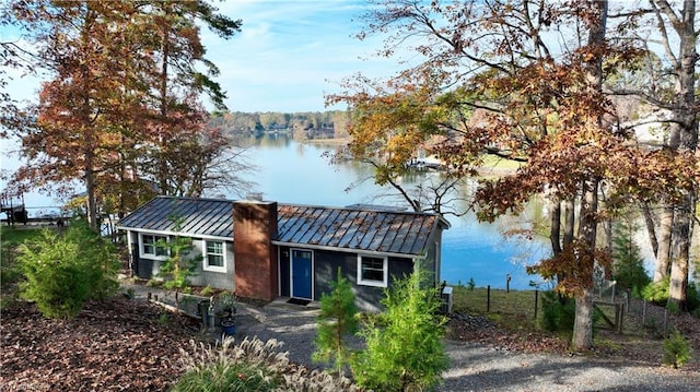 view of front facade with a water view