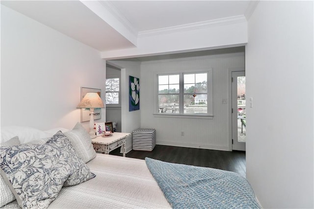 bedroom with crown molding and dark hardwood / wood-style flooring