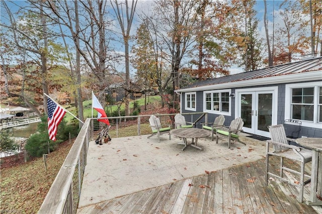 wooden deck featuring french doors